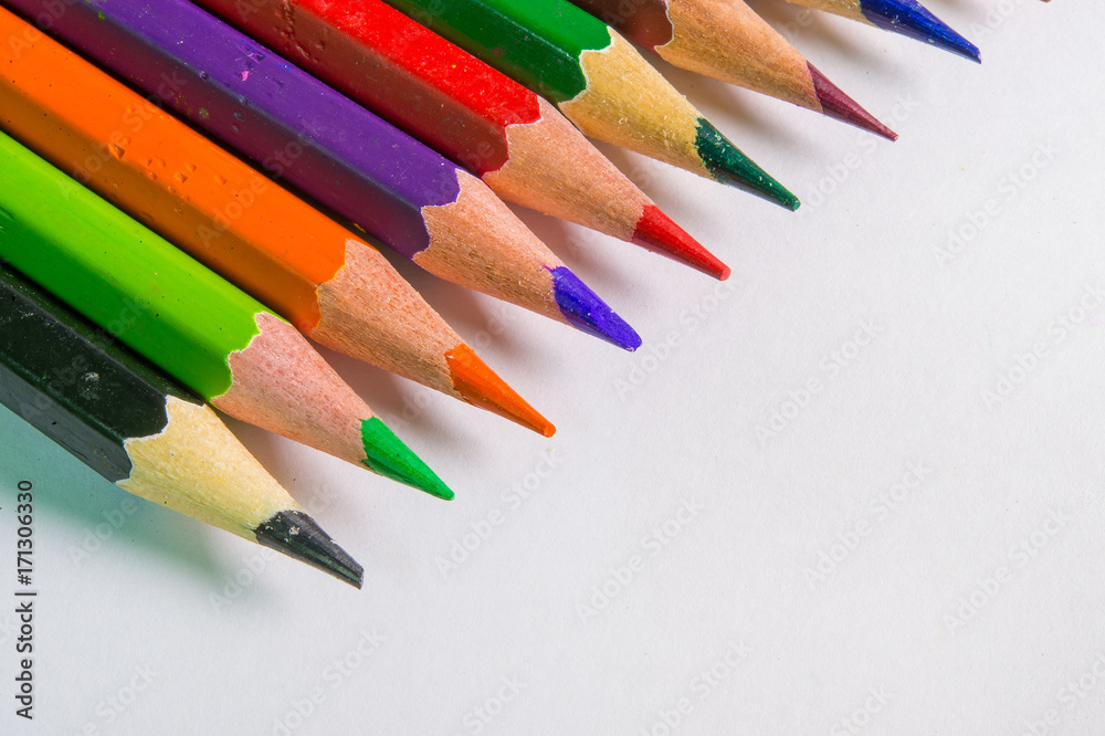 Color pencils in rainbow on white background Color pencils in rainbow on white background