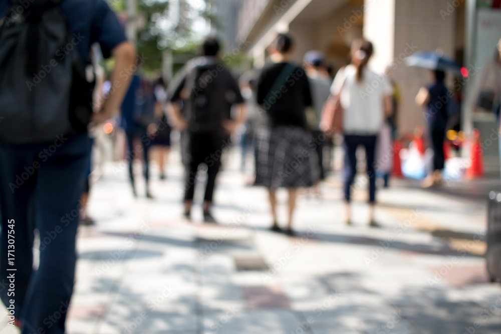 People Walking in the Middle of the City During Day at the City of Nagoya in Japan; Blur Background with Bokeh Effects