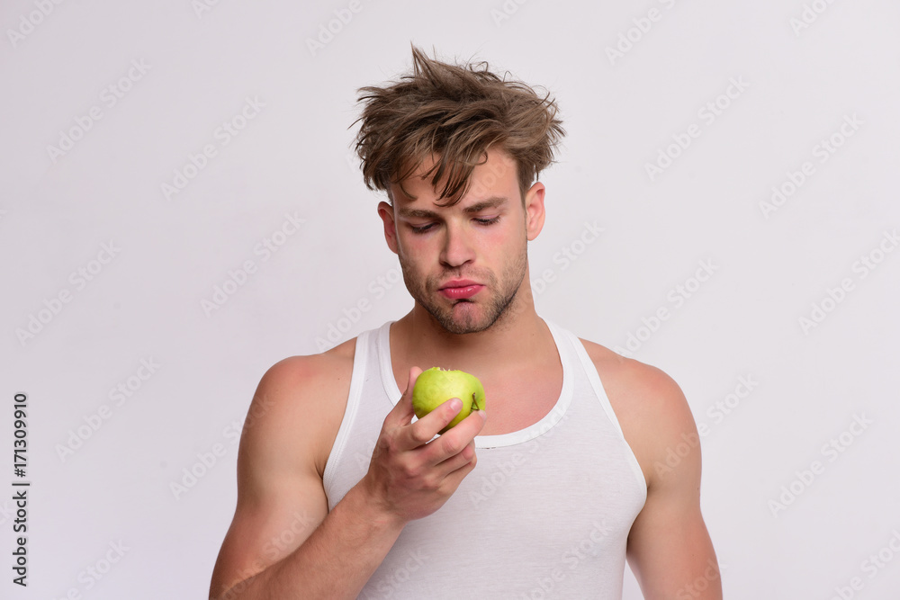 Guy with serious face isolated on light grey background Guy with serious face isolated on light grey background