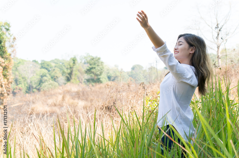 Asian woman feeling relax in green forest Asian woman feeling relax in green forest