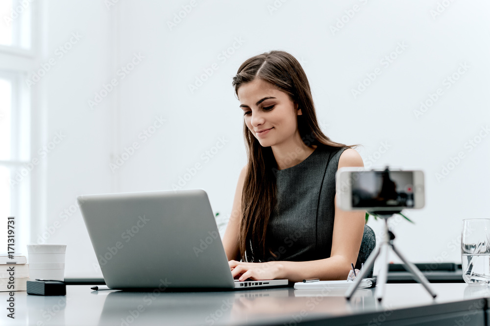 Female vlogger recording content for her video blog. Female vlogger recording content for her video blog.