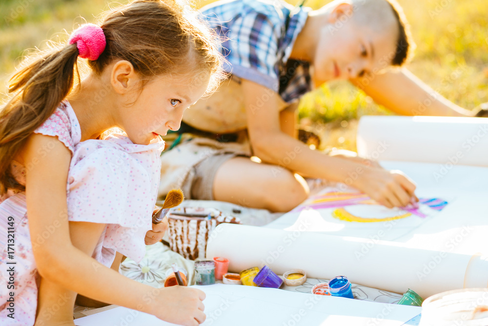 Portrait of two children painting, summer outdoor. Art, drawing and kids creativity concept. Portrait of two children painting, summer outdoor. Art, drawing and kids creativity concept.