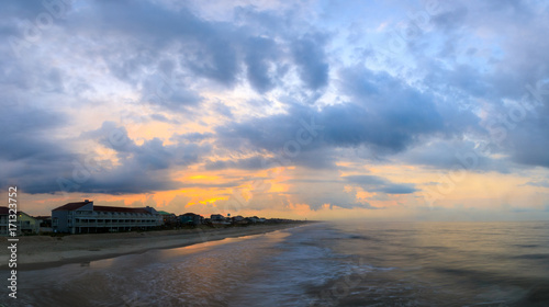 A view for a Pier in Oak Island at Sunrise