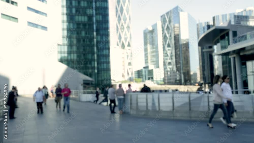 Crowd of people going to work near a modern business center, La Defense in Paris, France, during morning rush hour. Crowd of people going to work near a modern business center, La Defense in Paris, France, during morning rush hour.