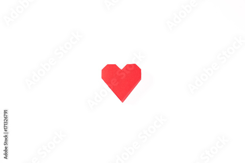 Red paper heart on a white background