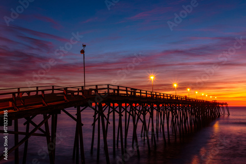 Fototapeta Naklejka Na Ścianę i Meble -  Sunrise at the Pier in Kure Beach, North Carolina