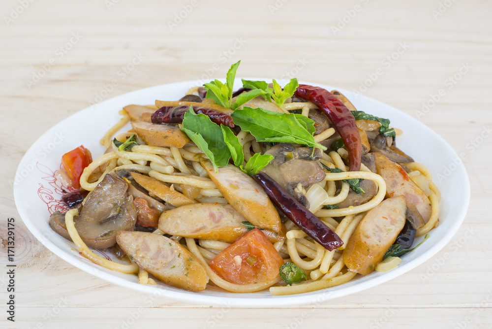 Stir fried spaghetti with sausage and dried chili Stir fried spaghetti with sausage and dried chili