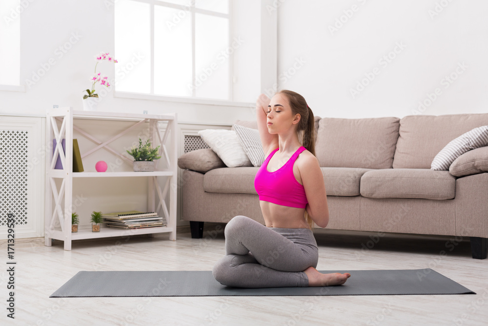 Woman training yoga in cow head pose. Woman training yoga in cow head pose.
