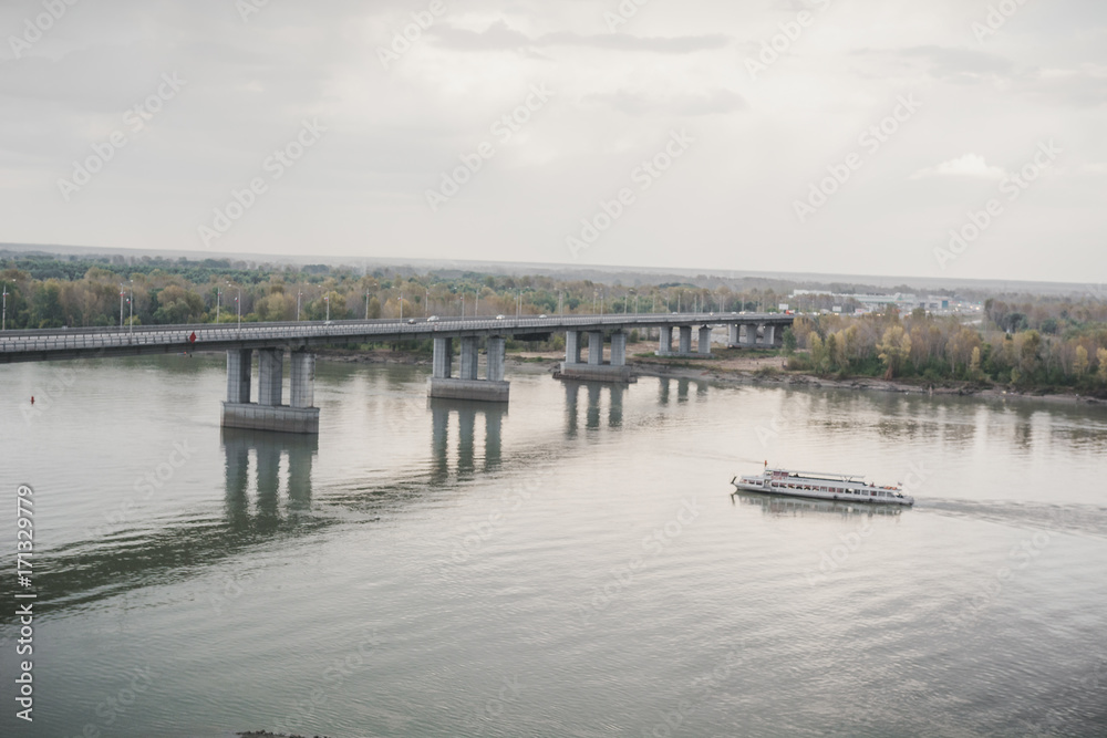 Naklejka premium The motor ship floats. River bus. The walking boat floats down the river.