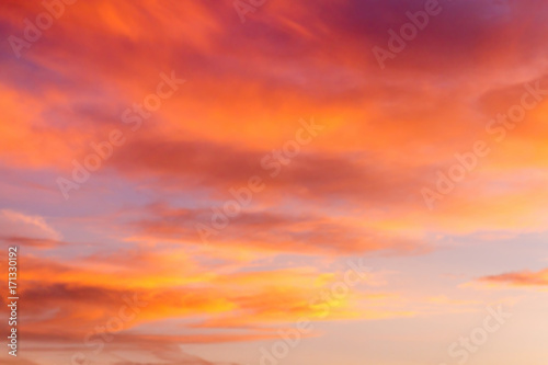 Dramatic sunrise sky with clouds.Blur or Defocus image. © ronnarong