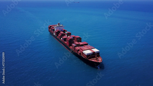 large huge container ship fully loaded at sea aerial shot