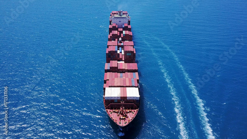 large huge container ship fully loaded at sea aerial shot