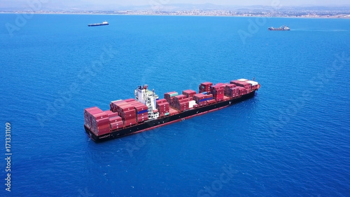 large huge container ship fully loaded at sea aerial shot