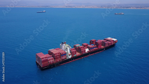large huge container ship fully loaded at sea aerial shot