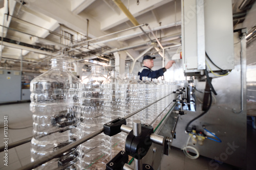Bottle. Industrial production of PET bottles. Transparent packaging for food products