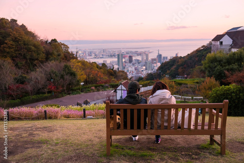 young couple see Kobe skyline at twilight photo
