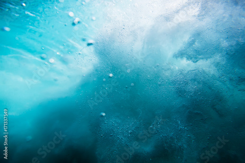 Wave texture underwater. Blue ocean in underwater