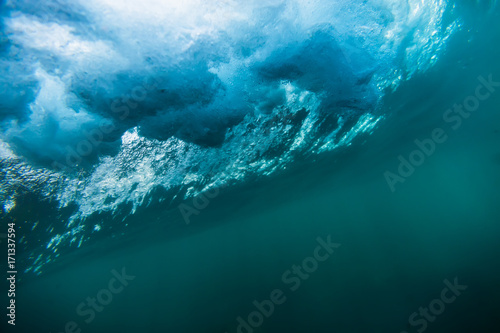 Blue wave texture underwater. Ocean in underwater