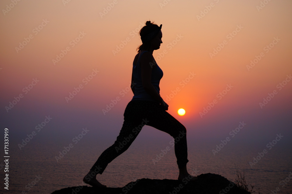 Yoga on the sunset, Female posing on the edge of the hill, happy relax moments