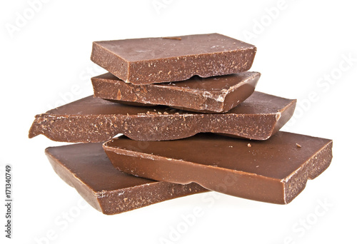 Pieces of milk chocolate on a white background