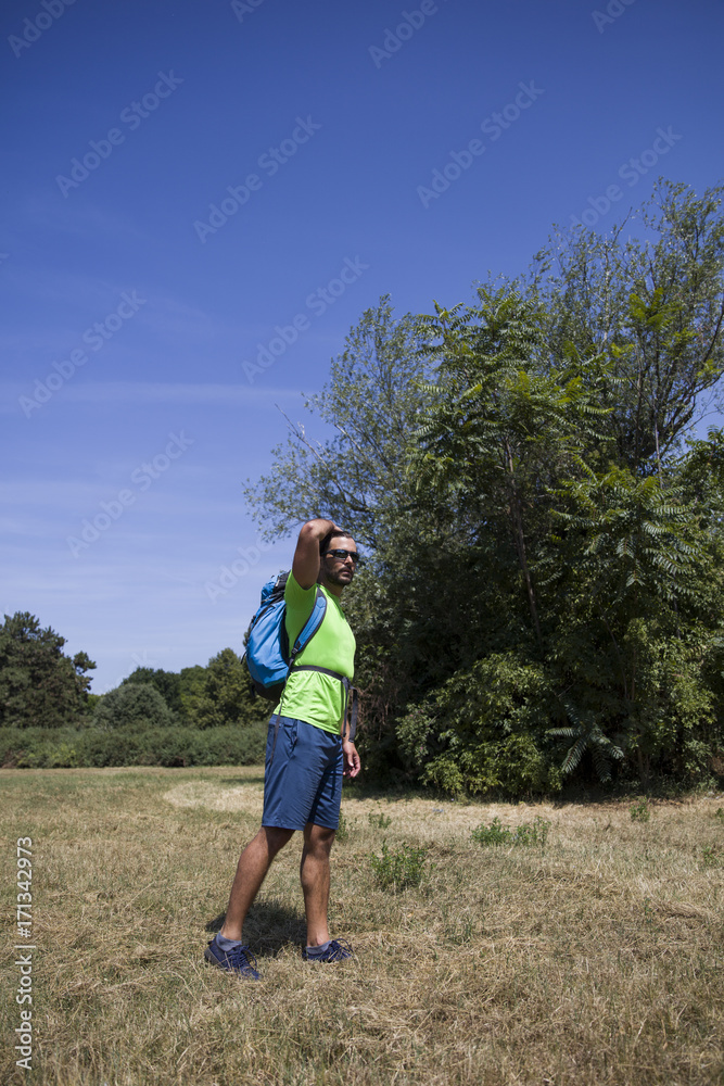 Young handsome hiker in the field Young handsome hiker in the field