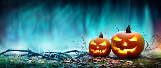 Jack O’ Lanterns Glowing At Moonlight In The Spooky Night - Halloween Scene
