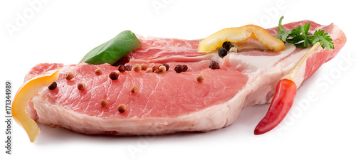 fresh meat steak with spices isolated on a white background