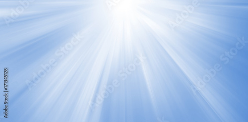 Sparkling glowing rays starlight starburst on a blue background banner.