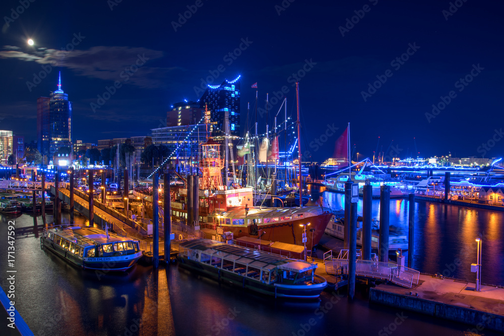 Hamburg, Panorama at night. With blue illuminated harbour - obrazy, fototapety, plakaty 