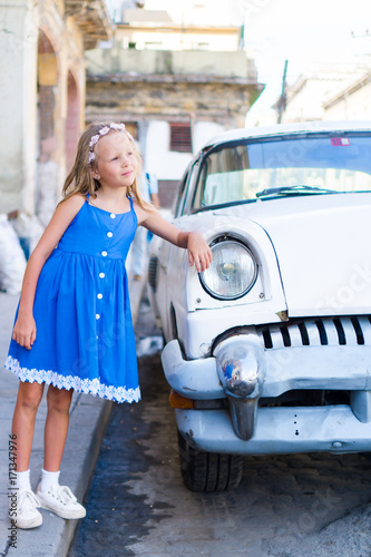 Photography Adorable little girl in popular area in Old Havana, Cuba