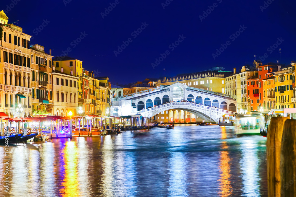 View of the Rialto Bridge and Grand Canal in Venice at night