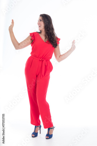 beautiful smiling young girl with long black hair in red dress,on white background 