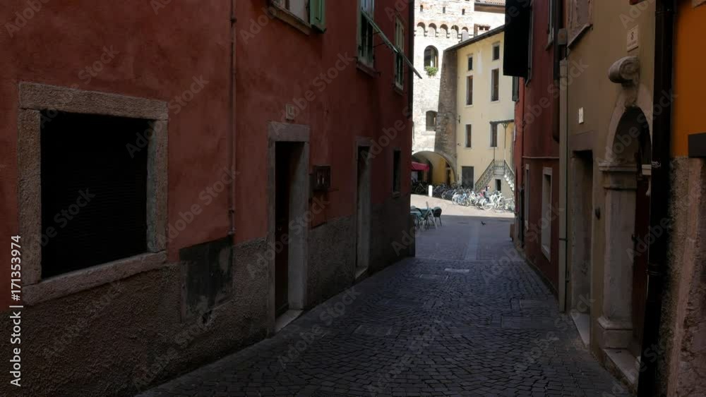 Narrow and romantic street in the old part of Riva del Garda town in Italy Narrow and romantic street in the old part of Riva del Garda town in Italy