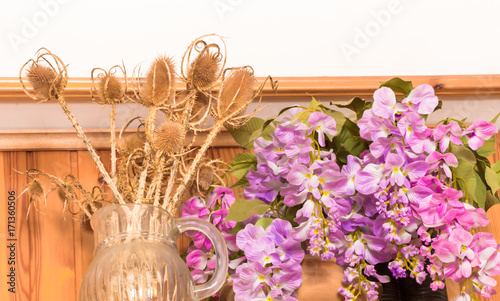 Bouquet of dried flowers in vase on wood background,Flower in vase, Beautiful colorful plastic flower bouquet in vase.