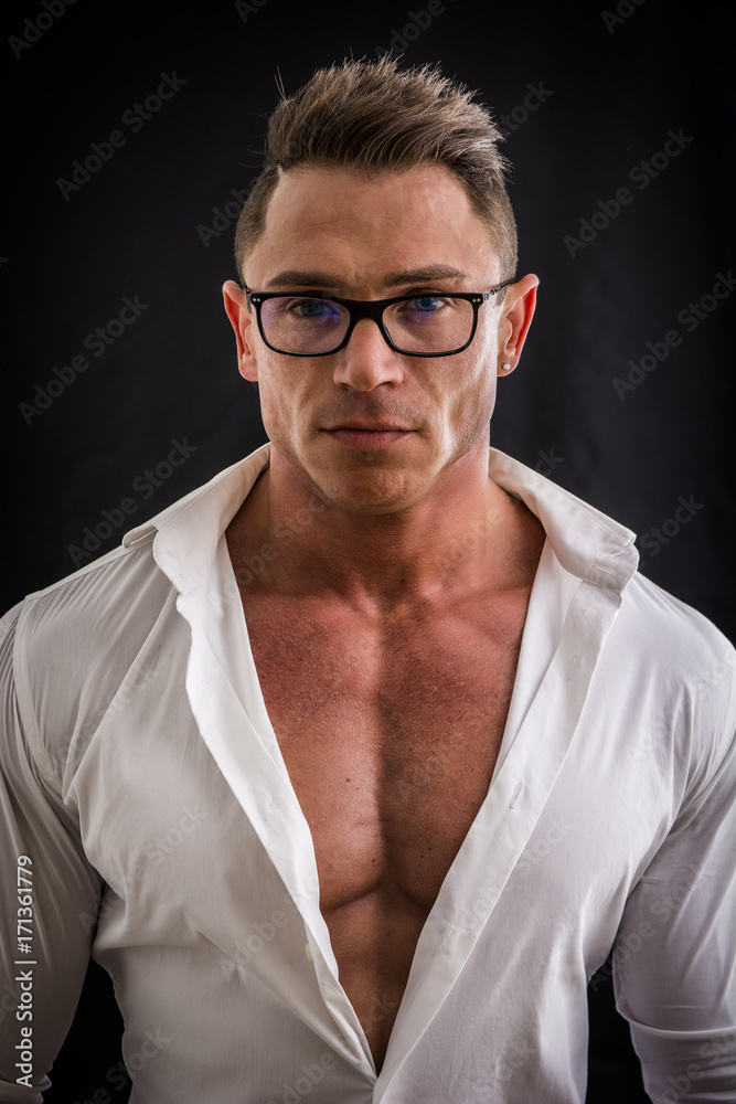 Dorky man with eyeglasses and muscle chest with ripped pecs