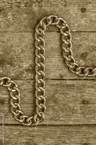 metal chain on wooden boards