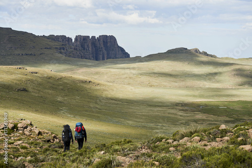 Two hikers with backpacks photo