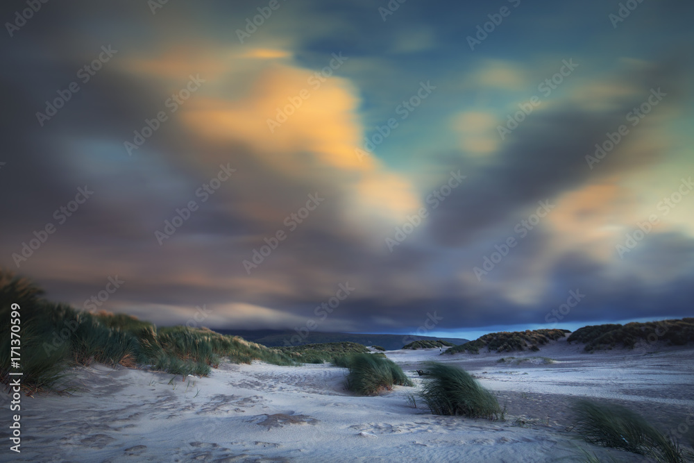 Colorful Blurry Clouds over Hilly Beach of Barmouth in North Wales