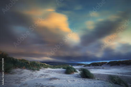 Colorful Blurry Clouds over Hilly Beach of Barmouth in North Wales © Eddie Cloud