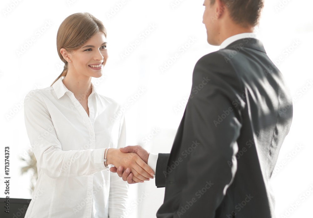 handshake young business woman with a colleague handshake young business woman with a colleague