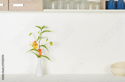 Flowers in the vase on the counter