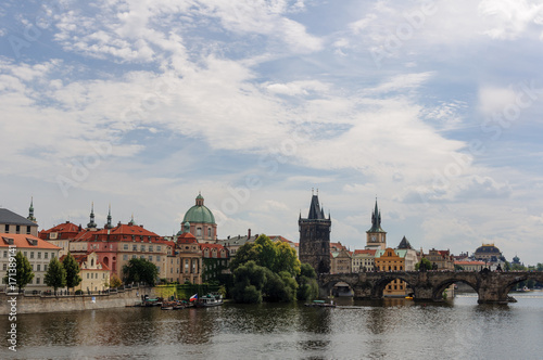Cityscape view on the riverside with the bridge and old town in Prague © Bohdana