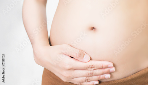 Selective focus Pregnancy test positive result  Blurred pregnant holding a result.