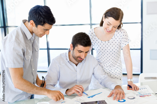 Group of happy young business people in a meeting