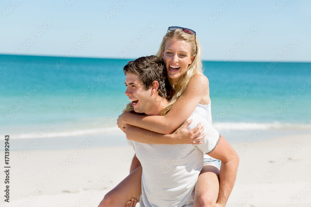 Portrait of man carrying girlfriend on his back Portrait of man carrying girlfriend on his back