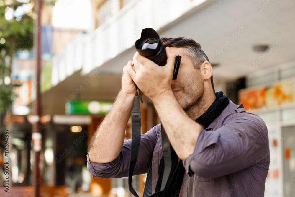 Male photographer taking picture