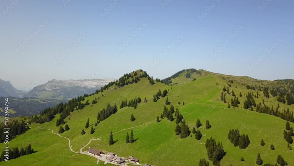 Drone flight over Swiss mountain peak in Europe