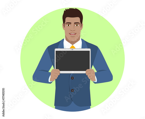 Businessman showing blank digital tablet PC