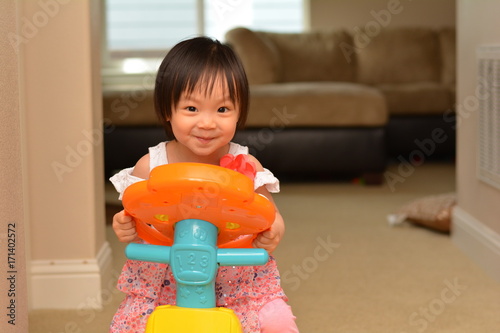 Girl Smiling and Playing on Car