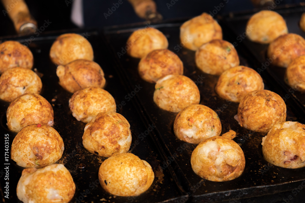 Takoyaki, Octopus balls, Japanese snack food made with octotopus and batter Takoyaki, Octopus balls, Japanese snack food made with octotopus and batter